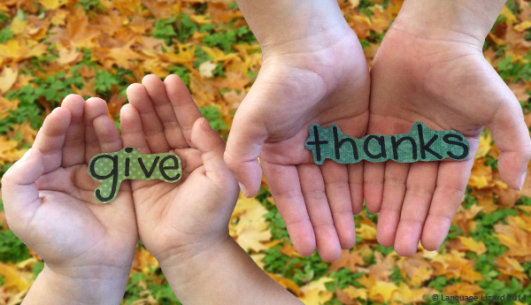 hands holding the words give thanks