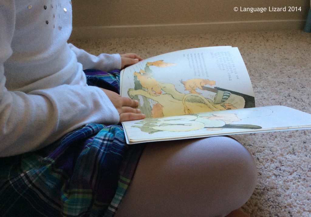 kid reading bilingual book