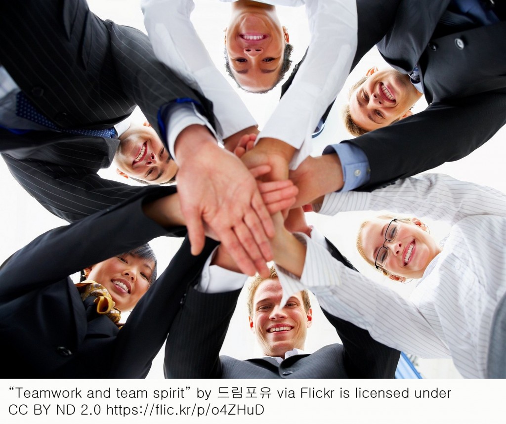 Teamwork and team spirit - Hands piled on top of one another .